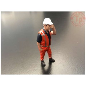 Pascal has a headache.Orange safety jacket with helmet AT COLLECTIONS 32143 AT COLLECTIONS