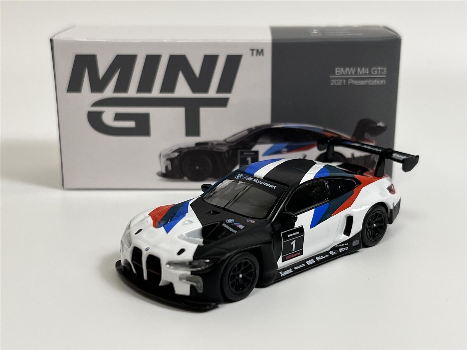 MGT00347-L BMW M4 GT3 2021 PRESENTATION WHITE/BLACK/BLUE/RED 1/64 1
