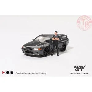 NISSAN SKYLINE GT-R (R32) NISMO NISMO GUNMETAL WITH TSUGIO MATSUDA FIGURE 1992 1:64 MGT00869-R MINI GT